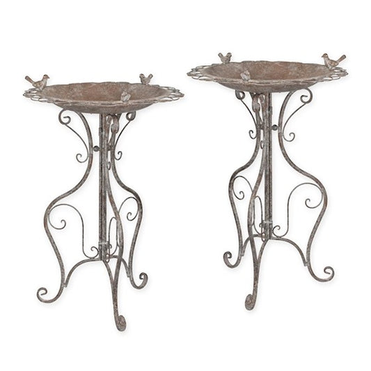 A PAIR OF IRON BIRD BATHS - WEATHERED GRAY